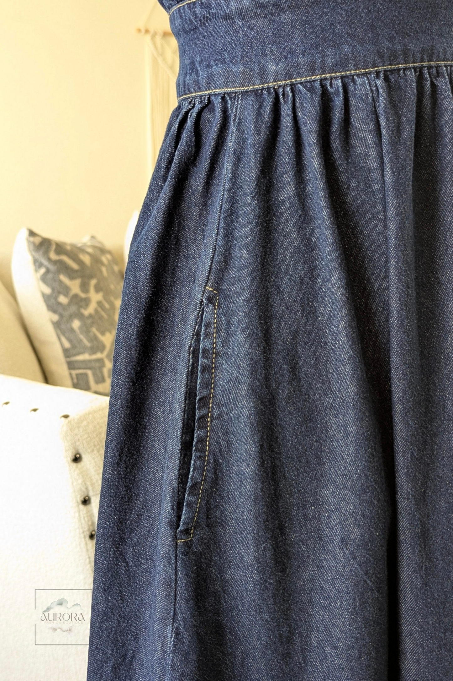 Blue denim A-line maxi dress with stitched waist detail and button closure