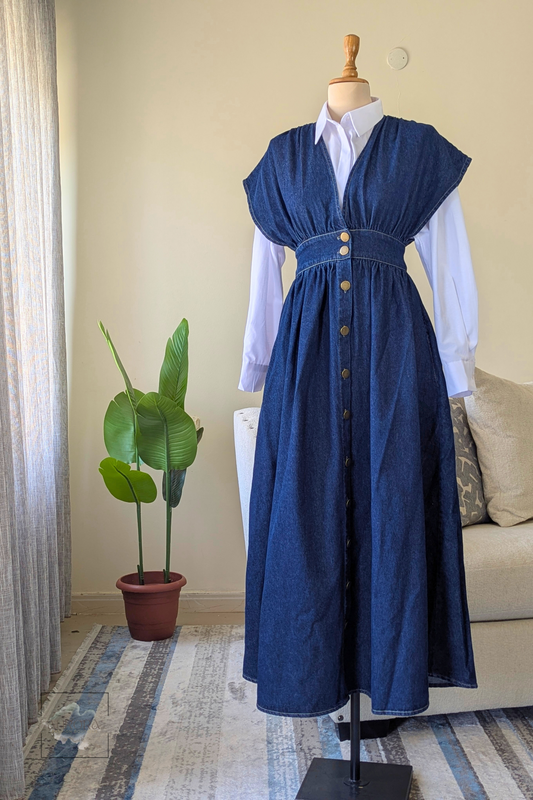 Denim maxi dress styled with white shirt for modest layered look