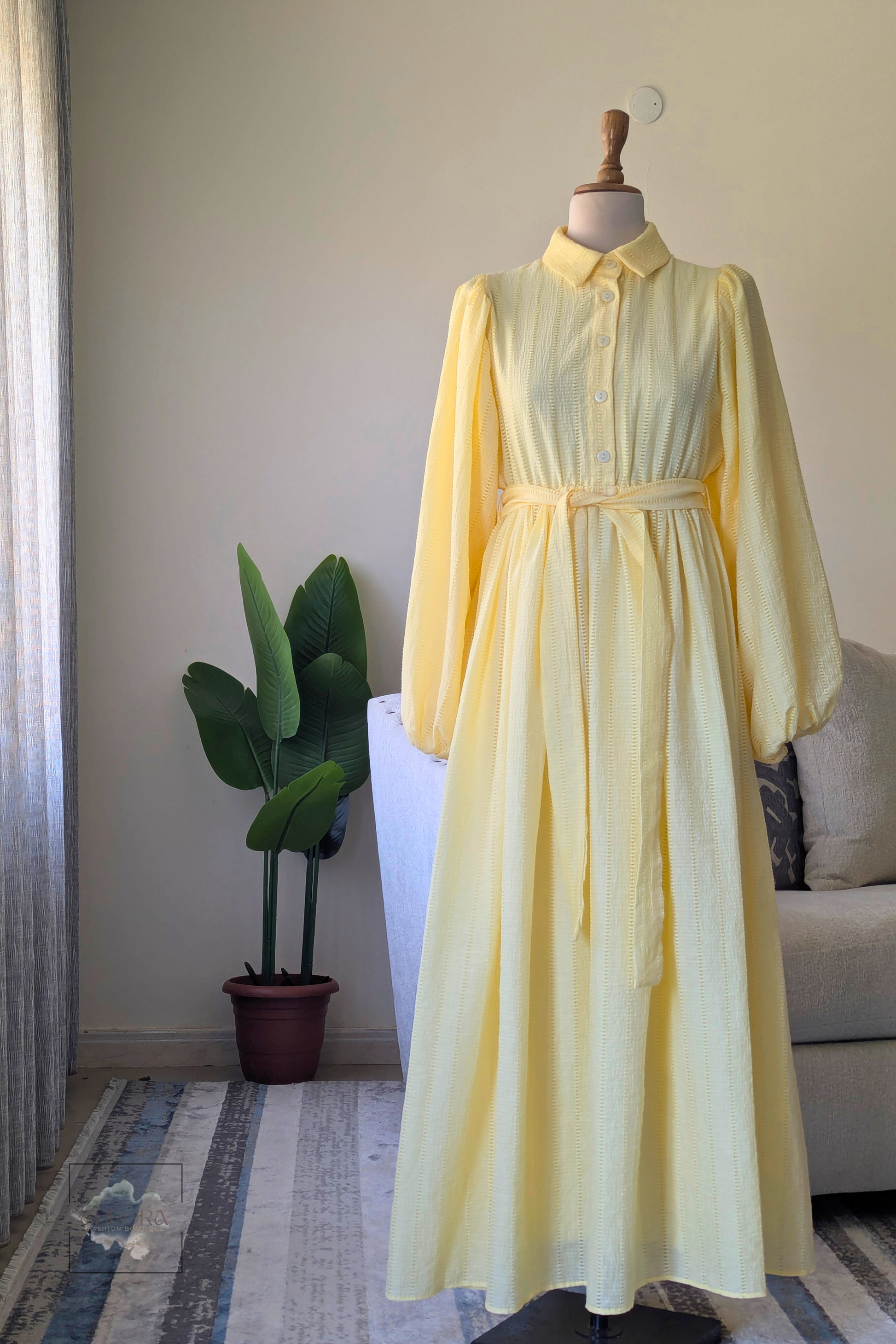 Aurora modest A-line cotton dress in yellow with fabric belt and balloon sleeves. Perfect for hijabis